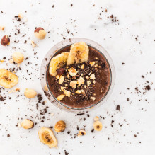 afternoon snack in a dairy-free box diet - cocoa-banana cocktail with hazelnut drink